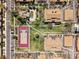 Aerial view of a neighborhood featuring a pool, tennis court, and mature landscaping at 540 S Forest St # 5-204, Denver, CO 80246