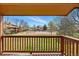 Outdoor balcony view showcasing tennis court and open community space with buildings at 540 S Forest St # 5-204, Denver, CO 80246