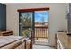 Bright bedroom featuring sliding doors to a private balcony, with natural light and neutral decor at 540 S Forest St # 5-204, Denver, CO 80246