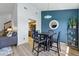 Inviting dining area with seating for four, modern lighting, and easy access to the kitchen and living area at 540 S Forest St # 5-204, Denver, CO 80246
