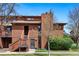 Charming two-story townhome featuring a wood exterior, well-manicured lawn, and an inviting entrance at 540 S Forest St # 5-204, Denver, CO 80246