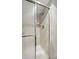 Shower enclosure with tiled walls and a clear glass door at 540 S Forest St # 5-204, Denver, CO 80246