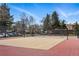 Outdoor tennis court surrounded by a black chain link fence, neighborhood in background at 540 S Forest St # 5-204, Denver, CO 80246