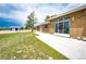 Backyard view featuring a well-manicured lawn and patio area, perfect for relaxation and outdoor enjoyment at 41020 Us Highway 36, Bennett, CO 80102