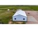 Aerial view of the well-maintained barn showcasing its ample space and functionality at 41020 Us Highway 36, Bennett, CO 80102