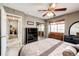 Serene bedroom with a ceiling fan, a bench by the window, and a mirrored closet at 41020 Us Highway 36, Bennett, CO 80102