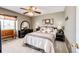 Inviting bedroom featuring a decorative ceiling fan, neutral color scheme, and lots of natural light at 41020 Us Highway 36, Bennett, CO 80102
