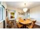 Elegant dining room features a wooden table, seating for six, chandelier lighting, and stylish decor at 41020 Us Highway 36, Bennett, CO 80102