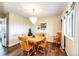 Inviting dining room featuring a wooden table, and natural light creating a warm ambiance for meals and gatherings at 41020 Us Highway 36, Bennett, CO 80102