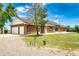 Brick home featuring an oversized two-car garage and back patio at 41020 Us Highway 36, Bennett, CO 80102