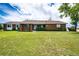 Charming brick home with a well-manicured lawn and a welcoming front entrance at 41020 Us Highway 36, Bennett, CO 80102