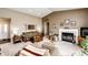 Cozy living room features a fireplace, comfortable seating, and ample natural light, perfect for relaxing and entertaining at 41020 Us Highway 36, Bennett, CO 80102