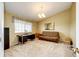 Home office/study featuring a large window, neutral carpet, a desk, and futon-style seating at 41020 Us Highway 36, Bennett, CO 80102