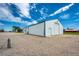 View of the extra-large outbuilding with multiple doors and ample parking at 41020 Us Highway 36, Bennett, CO 80102