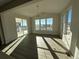 Bright dining room with hardwood floors and sliding glass doors at 5500 Riverbend Ave, Firestone, CO 80504