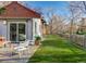 Landscaped backyard, features a patio and a wooden fence at 3525 E 7Th Avenue Pkwy, Denver, CO 80206