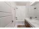 Clean bathroom with a bathtub, double vanity, and modern fixtures at 3525 E 7Th Avenue Pkwy, Denver, CO 80206