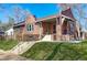 Brick home with a front porch and landscaped yard at 3525 E 7Th Avenue Pkwy, Denver, CO 80206