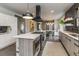 Modern kitchen with white cabinets and large island at 3525 E 7Th Avenue Pkwy, Denver, CO 80206