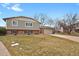 House exterior showcasing a well-maintained lawn and driveway at 4531 S Iris St, Littleton, CO 80123