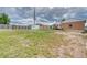 Large backyard with grass, fencing and sheds at 10420 Marion St, Northglenn, CO 80233