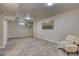 Spacious finished basement with plush carpeting, recessed lighting, and a comfortable sitting area at 10420 Marion St, Northglenn, CO 80233