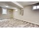 Bright basement featuring plush carpeting and three windows providing lots of natural lighting at 10420 Marion St, Northglenn, CO 80233