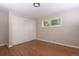 Bedroom with hardwood floors and closet storage at 10420 Marion St, Northglenn, CO 80233