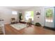 Bright living room with hardwood floors, neutral colors and a large window at 10420 Marion St, Northglenn, CO 80233