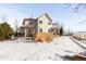 View of the home from the backyard in winter at 1669 S De Gaulle Way, Aurora, CO 80018