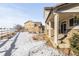 Landscaped backyard with snow, providing privacy at 1669 S De Gaulle Way, Aurora, CO 80018