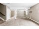 Unfinished basement with large open space and carpet at 1669 S De Gaulle Way, Aurora, CO 80018