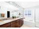 Elegant bathroom with double vanity, soaking tub, and shower at 1669 S De Gaulle Way, Aurora, CO 80018