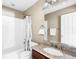 Clean bathroom with shower/tub combo and granite countertop at 1669 S De Gaulle Way, Aurora, CO 80018