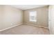 Bright and airy bedroom with carpeted floor and window at 1669 S De Gaulle Way, Aurora, CO 80018