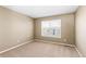 Simple bedroom with carpeted floor and window at 1669 S De Gaulle Way, Aurora, CO 80018