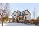 Two-story house with stone accents and front porch at 1669 S De Gaulle Way, Aurora, CO 80018