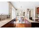 Kitchen with sink, island, and view into the dining area at 1669 S De Gaulle Way, Aurora, CO 80018