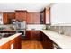 Modern kitchen with granite countertops, double ovens, and ample cabinet space at 1669 S De Gaulle Way, Aurora, CO 80018