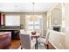 Kitchen nook with table and chairs, offering a view of the backyard at 1669 S De Gaulle Way, Aurora, CO 80018