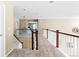 Upstairs hall with carpet, stairs, and railing at 1669 S De Gaulle Way, Aurora, CO 80018