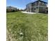 Expansive backyard with green lawn and patio provides ample space for recreation and entertaining at 3508 Silverado Cir, Frederick, CO 80516