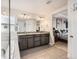Bathroom featuring double sinks, granite countertops, and combination tub shower with tile surround at 3508 Silverado Cir, Frederick, CO 80516