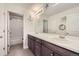 Bathroom features double sinks, ample storage, and combination tub shower with tile surround at 3508 Silverado Cir, Frederick, CO 80516