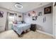 Bedroom with comfortable carpeting, cute decor, and plenty of natural light at 3508 Silverado Cir, Frederick, CO 80516