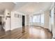 Bright dining room with hardwood floors, chandelier, and large windows at 3508 Silverado Cir, Frederick, CO 80516