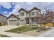 Charming two-story home with a three-car garage and blooming tree at 3508 Silverado Cir, Frederick, CO 80516