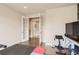 Additional gym space with workout equipment, rubber flooring, and views to other rooms at 3508 Silverado Cir, Frederick, CO 80516