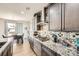 Well-equipped kitchen showcases granite countertops, custom backsplash, and ample cabinet space at 3508 Silverado Cir, Frederick, CO 80516