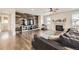 Stylish living room with hardwood floors, fireplace, and wood accent wall at 3508 Silverado Cir, Frederick, CO 80516